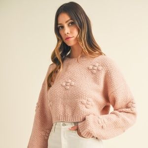 Long sleeve fuzzy 3D floral textured detail crop knit sweater top.